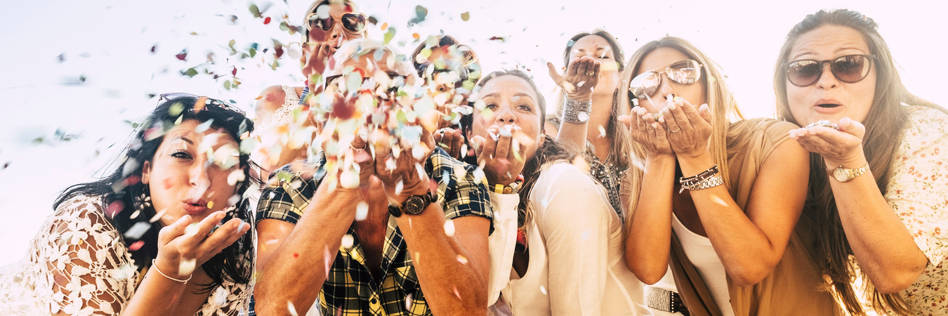 Group of Female People Friends Celebrate Together Blowing Confet