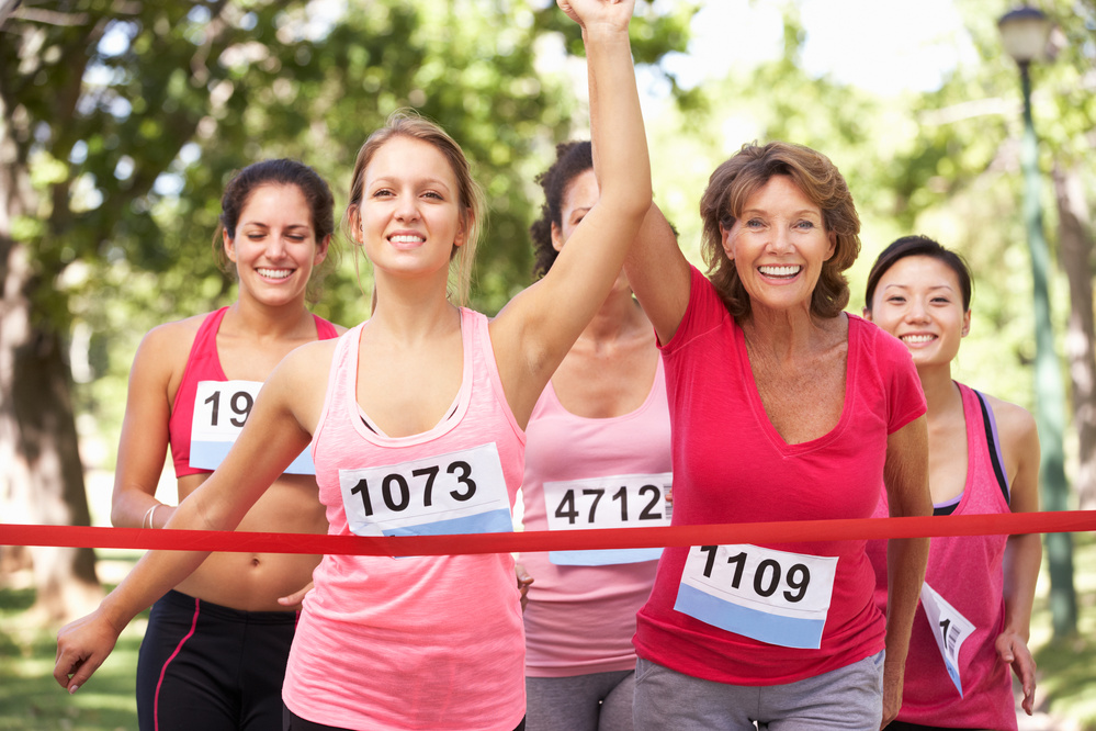 Group of Female Athletes Completing  Charity Marathon Race